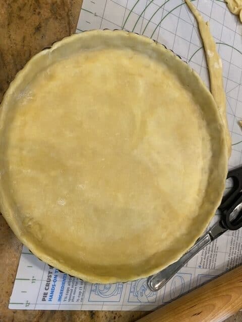 put pastry in tin and cut off excess dough
